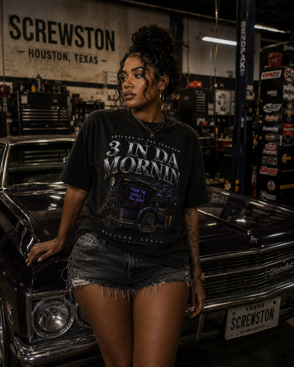 Model wearing the black 3 In Da Mornin drop shoulder tee