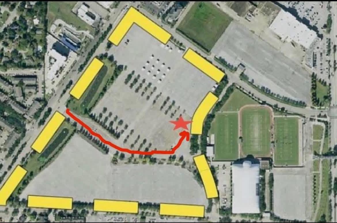 Organizer aerial reference showing the marked route through the Yellow Lot to the east-side meetup area